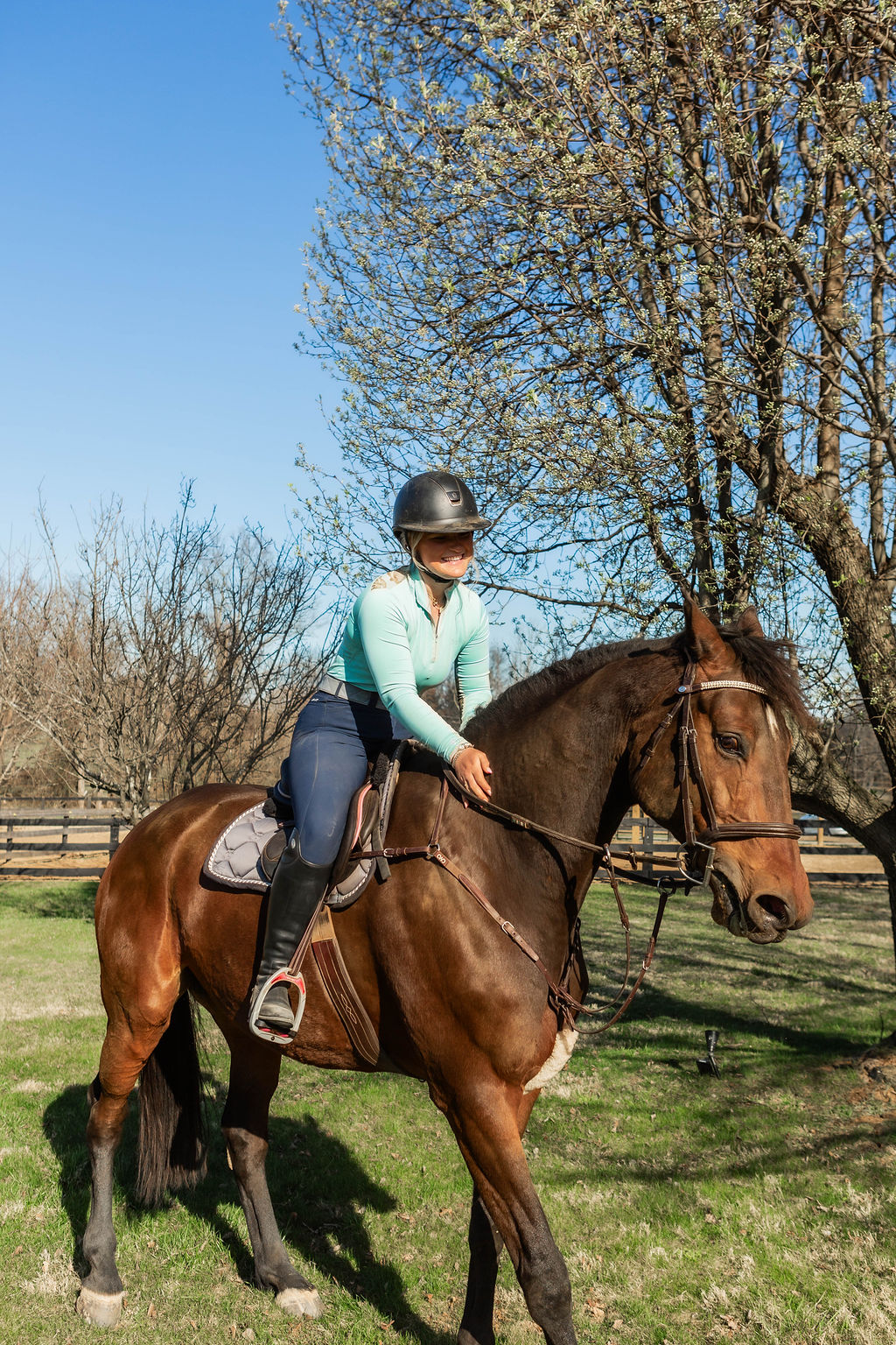 Adult rider on a chestnut horse at Serene Acres